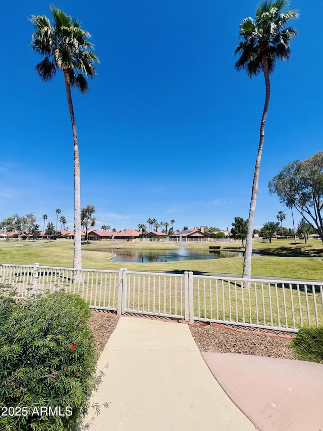 11006 E Navajo Dr, Sun Lakes, AZ 85248 - view of patio with a water view and fence