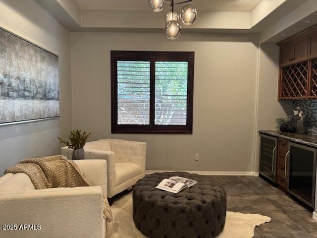 living area with wine cooler and indoor bar