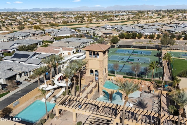 birds eye view of property with a mountain view