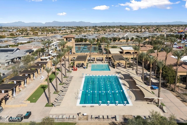 view of swimming pool featuring a mountain view