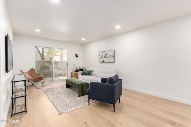 living room with light hardwood / wood-style flooring