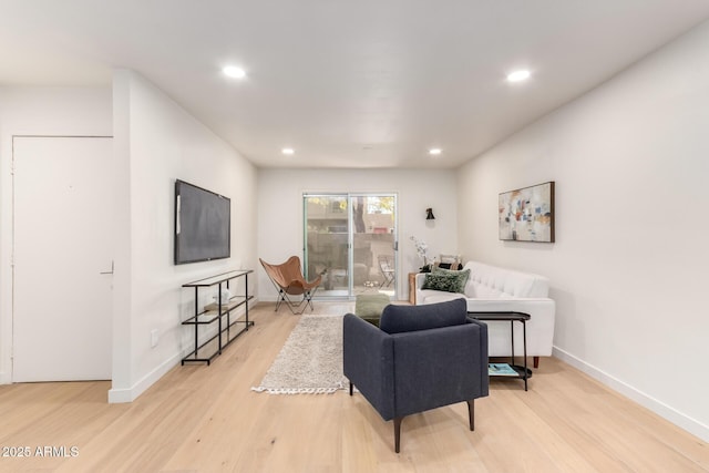 living room with light hardwood / wood-style flooring