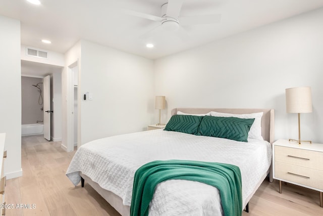 bedroom with light hardwood / wood-style flooring and ceiling fan