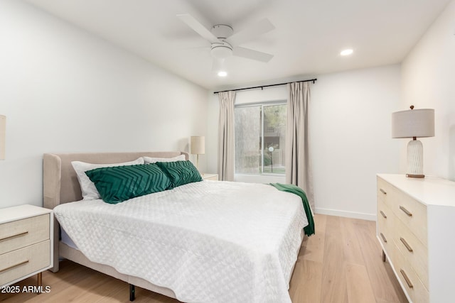 bedroom featuring ceiling fan and light hardwood / wood-style flooring