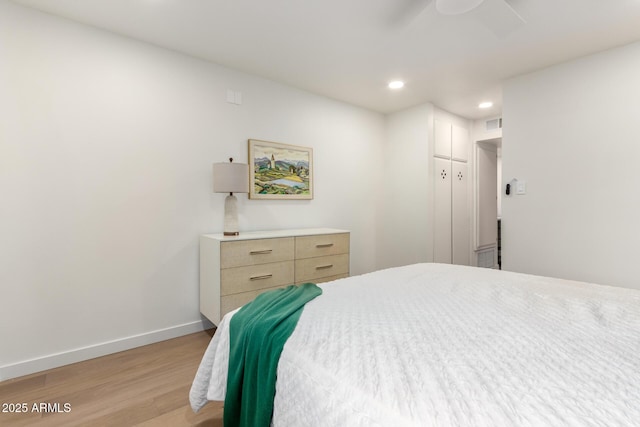 bedroom featuring light hardwood / wood-style floors and ceiling fan