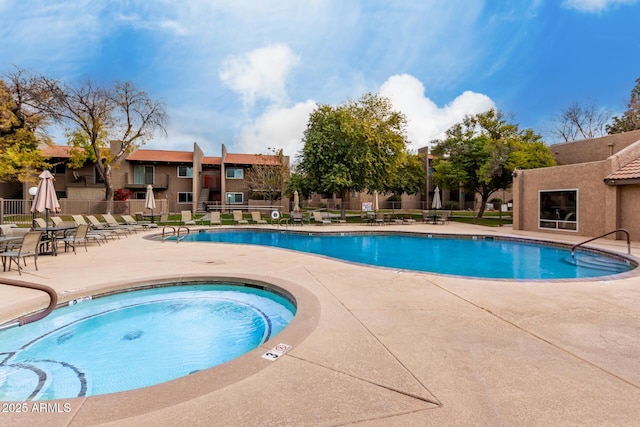 view of swimming pool with a patio area