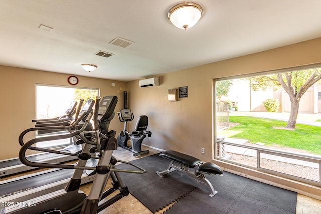 workout room with a wall mounted air conditioner