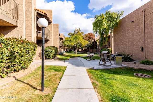 view of property's community featuring a yard