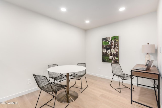 dining area with light hardwood / wood-style flooring