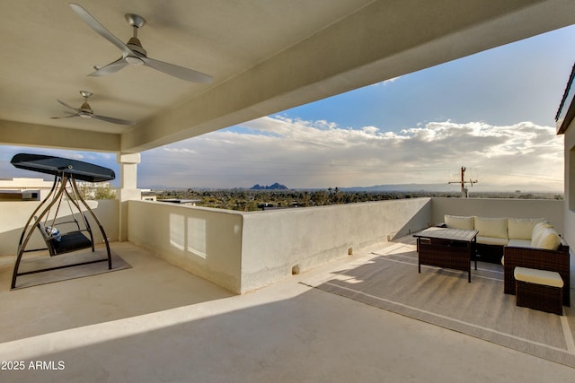 view of patio with ceiling fan and an outdoor hangout area