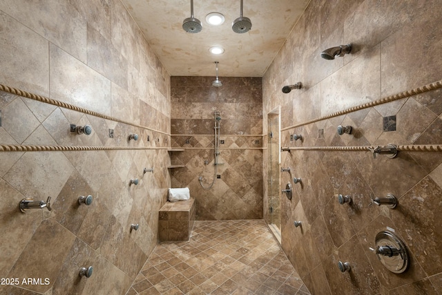 bathroom with a tile shower