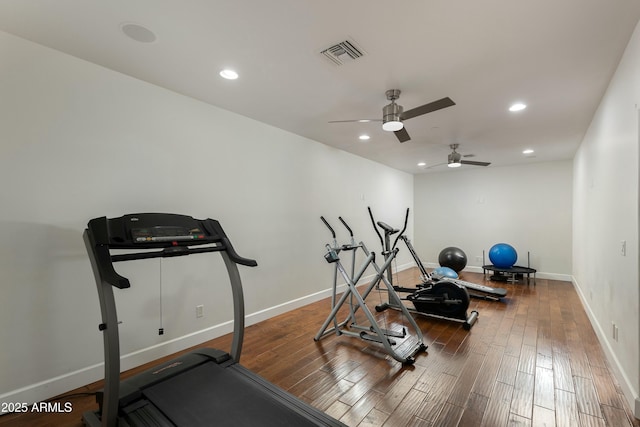 exercise room with recessed lighting, visible vents, and wood finished floors