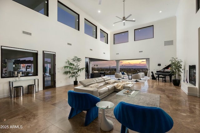 living area with ornamental molding, visible vents, and baseboards