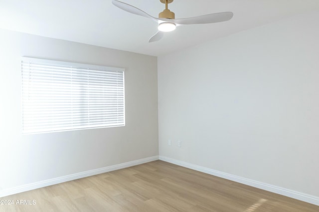 empty room featuring ceiling fan and light hardwood / wood-style floors