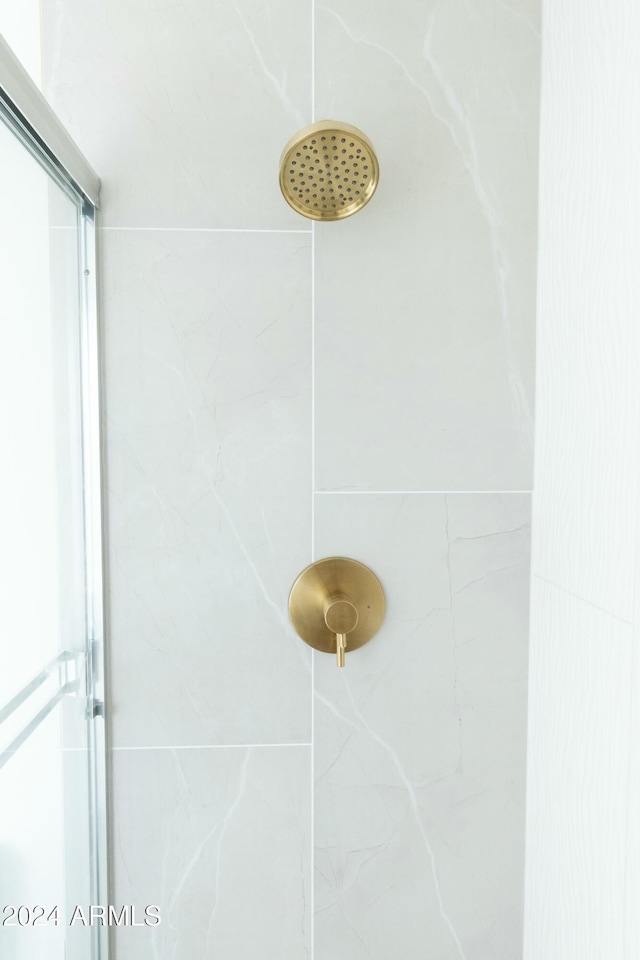 room details with a tile shower