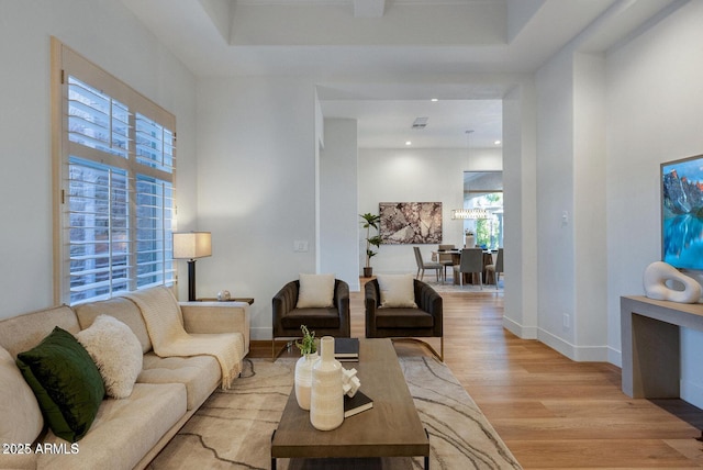 815 E County Down Dr, Chandler, AZ 85249 - living area with baseboards, a high ceiling, and light wood-style floors