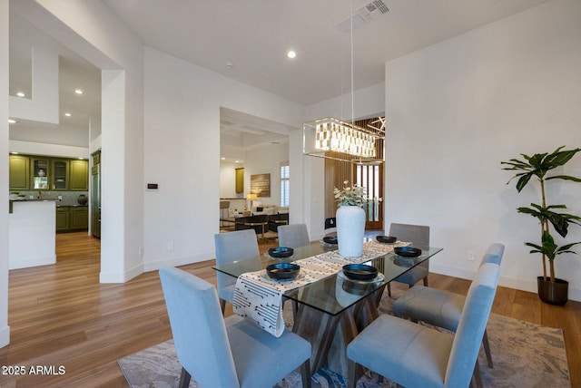 815 E County Down Dr, Chandler, AZ 85249 - dining area with recessed lighting, a notable chandelier, baseboards, and wood finished floors
