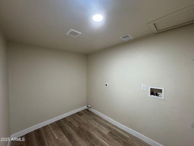 clothes washing area with wood-type flooring, electric dryer hookup, and washer hookup