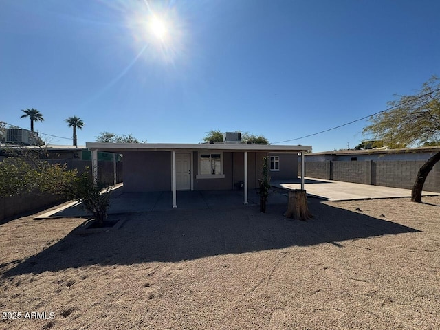 view of front of home featuring central AC unit and a patio area