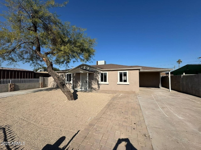 ranch-style house with a carport