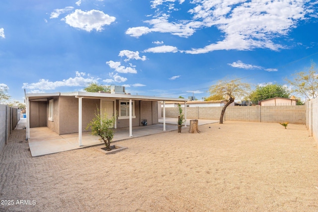 rear view of house with a patio