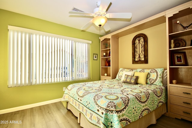 bedroom featuring hardwood / wood-style flooring and ceiling fan