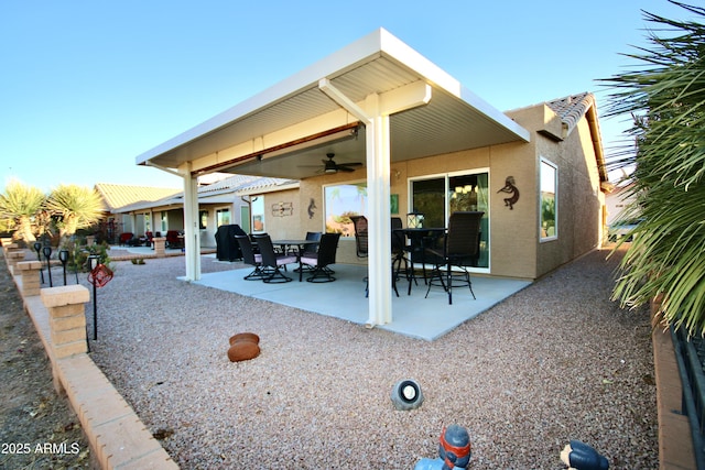 exterior space with ceiling fan