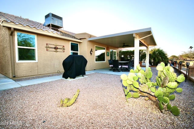 rear view of house with a patio and ceiling fan