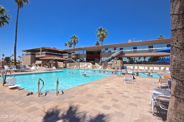 view of swimming pool featuring a patio