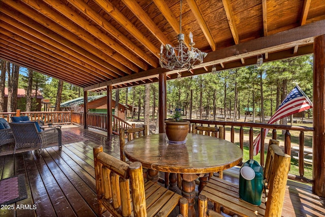 2295 Bison Ranch Trl, Overgaard, AZ 85933 - deck with outdoor dining space and view of scattered trees