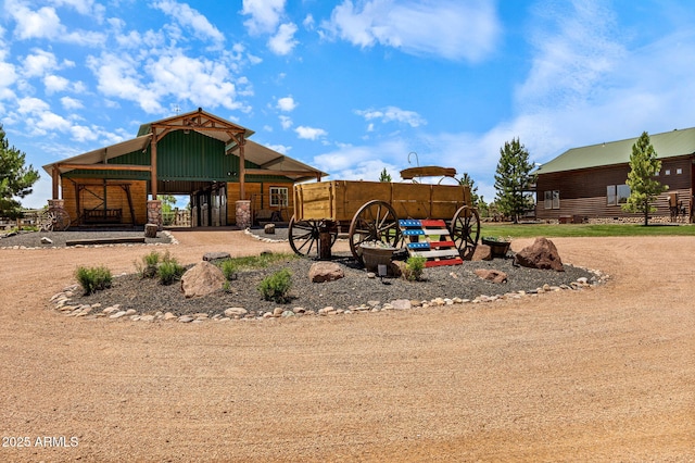 2295 Bison Ranch Trl, Overgaard, AZ 85933 - rear view of house featuring an outbuilding