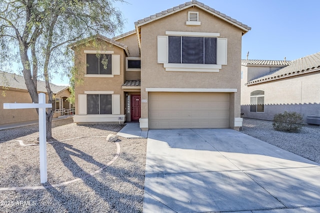 view of front of property with a garage