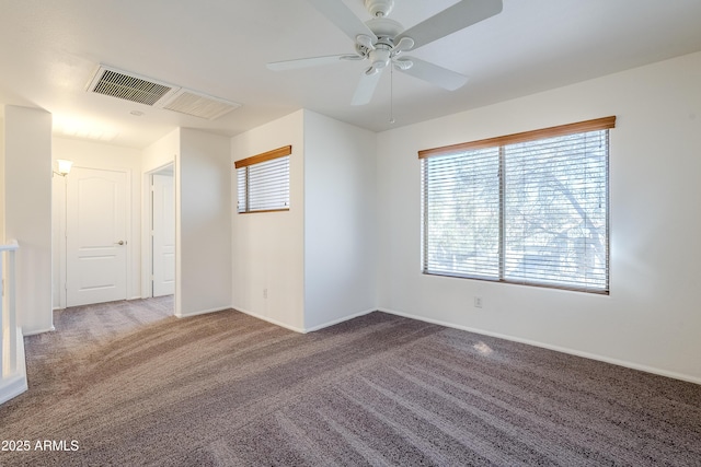 carpeted empty room with ceiling fan