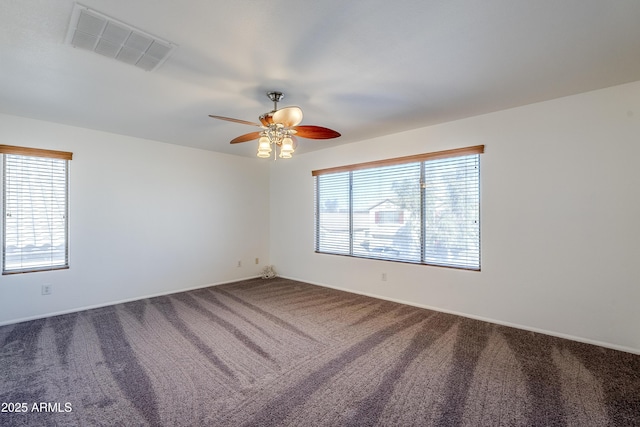 spare room featuring carpet floors and ceiling fan