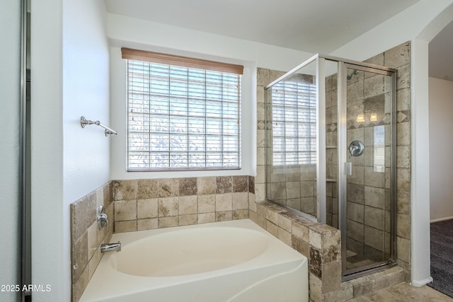 bathroom with separate shower and tub