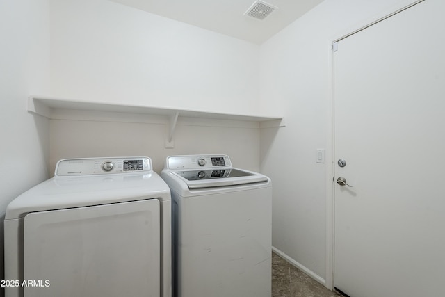 laundry room featuring washing machine and clothes dryer