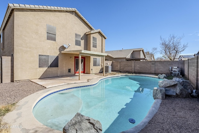 view of swimming pool featuring cooling unit and a patio area