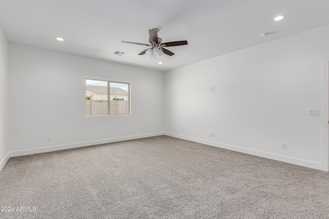 empty room featuring ceiling fan and carpet floors