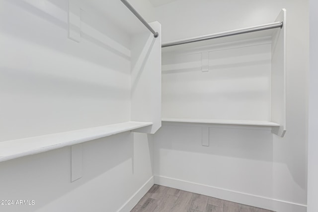 spacious closet with light wood-type flooring