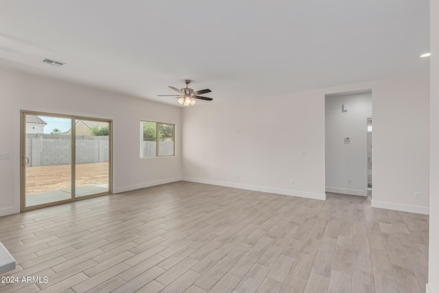 unfurnished room featuring ceiling fan and light hardwood / wood-style flooring