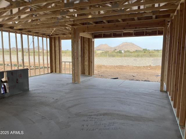 miscellaneous room with a mountain view