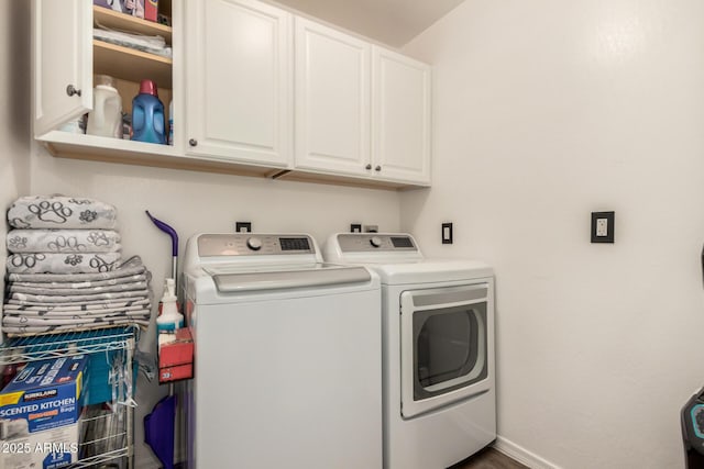 laundry room featuring cabinet space, independent washer and dryer, and baseboards