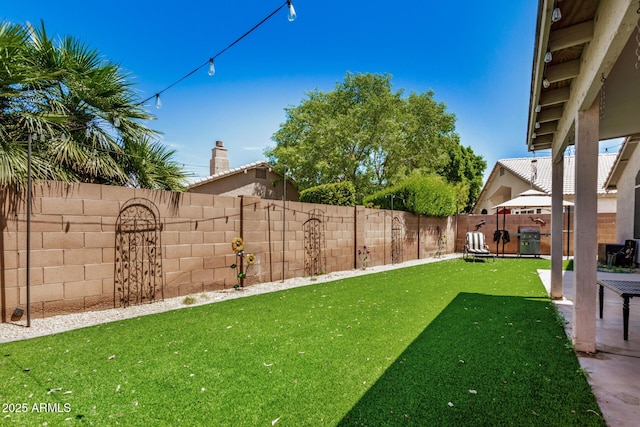 view of yard featuring a fenced backyard