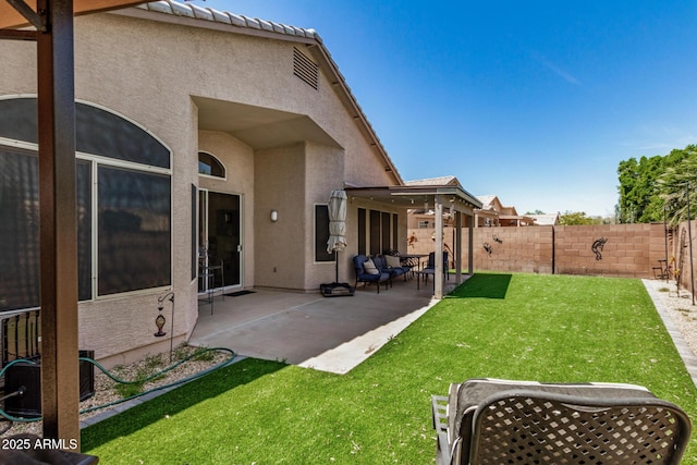 view of yard with a fenced backyard, a patio, and central AC unit