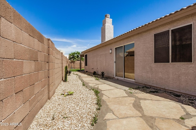 view of yard with fence and a patio