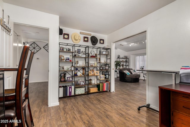 office space featuring track lighting and wood finished floors