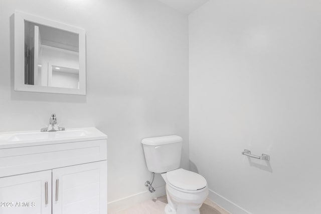 bathroom with toilet and vanity