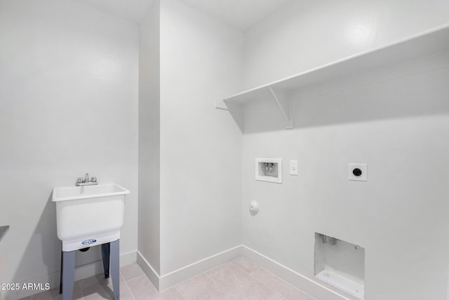 laundry area featuring electric dryer hookup, hookup for a washing machine, and light tile patterned flooring