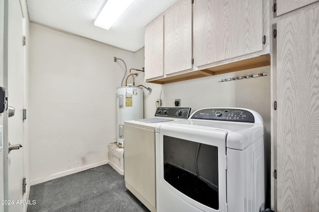 laundry room featuring cabinets, electric water heater, dark colored carpet, washer and dryer, and a textured ceiling