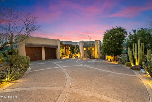 southwest-style home with a garage